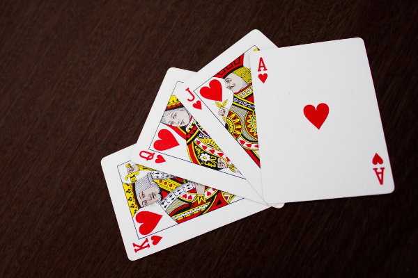 Splayed cards to represent things to look for in a casino