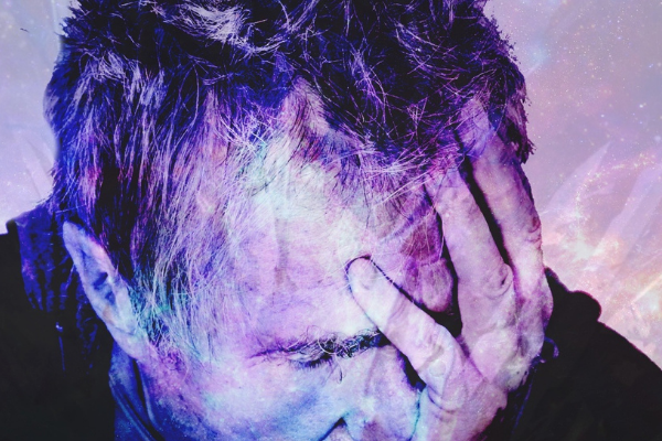 A man with his head in his hands. I used this image because it shows regret and this article is about making mistakes. The picture of the man is a bit of an arty rendition and has colour splashed over it.